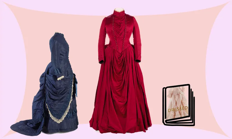 Two sumptuous 1800s dresses, one red and one navy, photographed on mannequins.