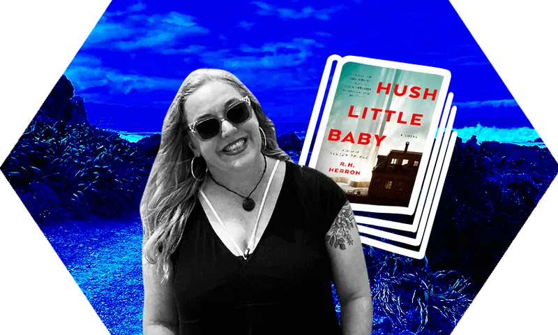 Smiling long-haired woman in sunnies against a backdrop of a rocky beach, whitecaps. Washed in dark blue. A book cover beside her.