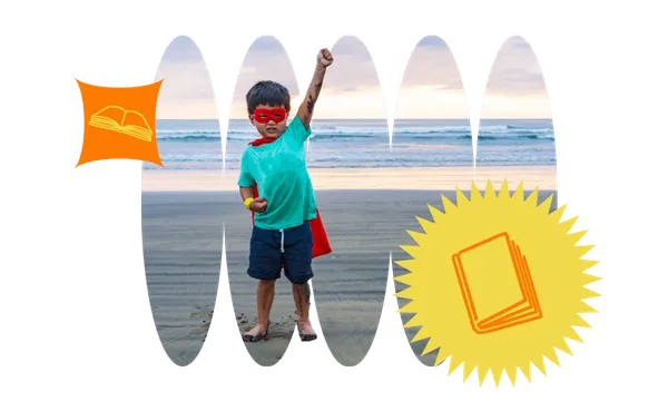 Young boy in superhero costume on beach, one triumphant fist punching the sky.