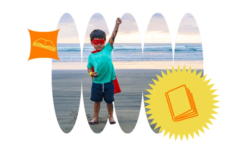 Young boy in superhero costume on beach, one triumphant fist punching the sky.