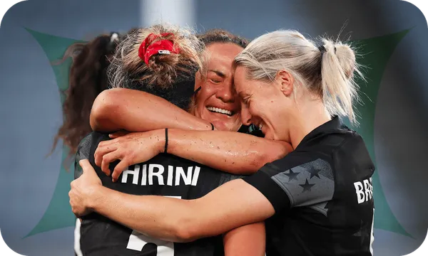 Compelling photograph of three women embracing and crying with joy.