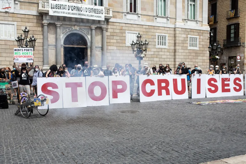 Protesters hold placards during the demonstration against