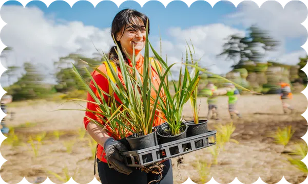 Lady-carrying-plants-Credit-Sustainable-Coastlines-CC-BY-NC-2.0.png