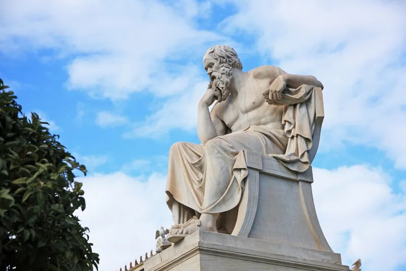 big ol staue of socrates looking thinky