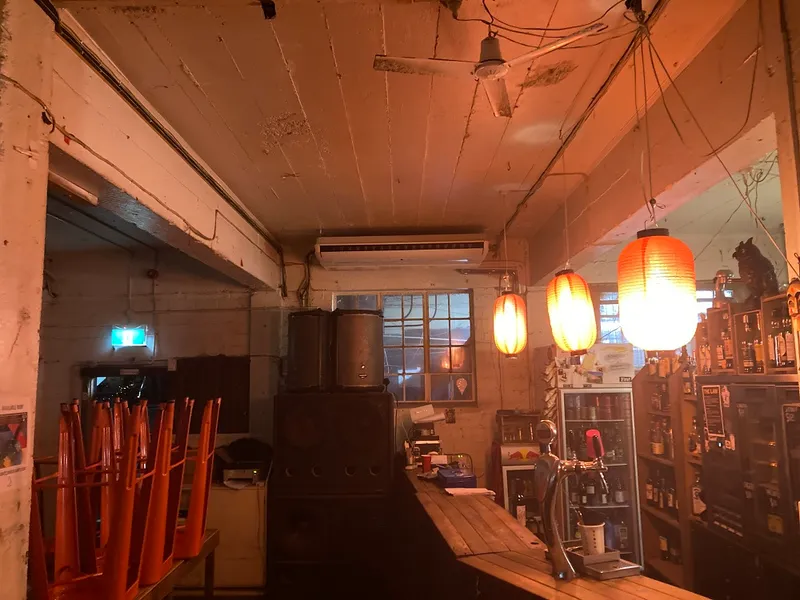 a dimly lit room with lamps!