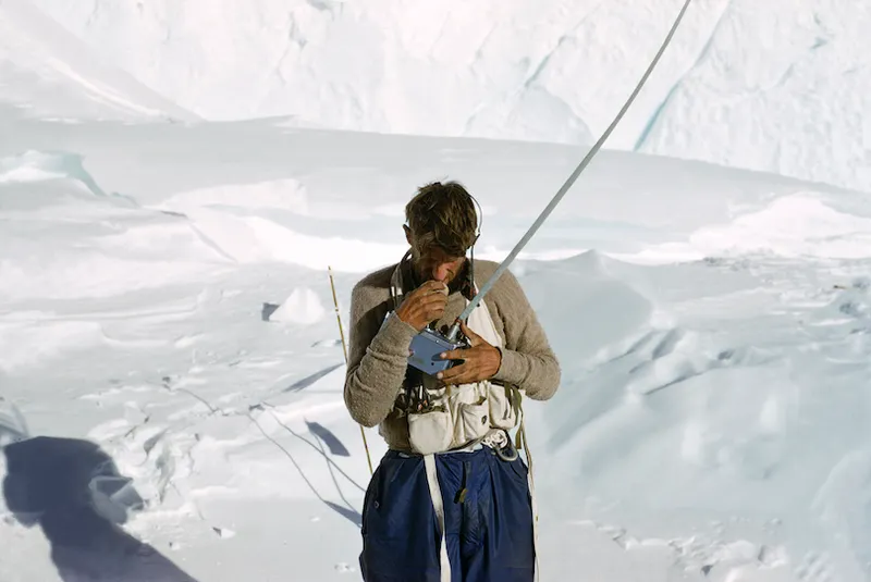 Edmund Hillary talking into the radio (supplied by Pye Telecommunications Limited) at Camp VII