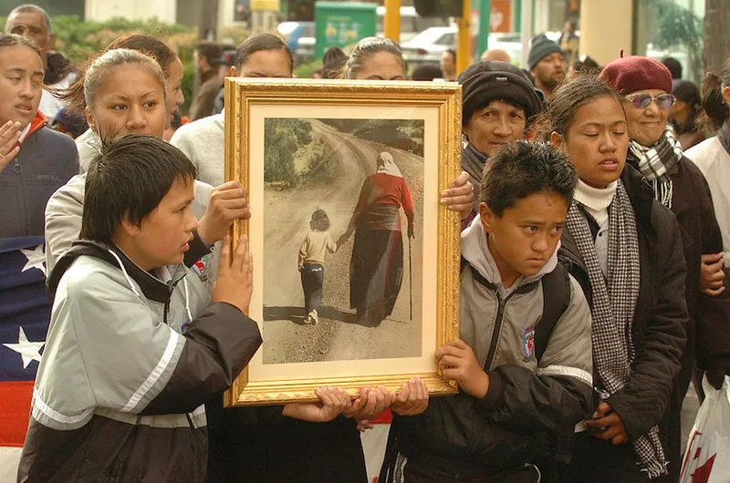 A group of students hold a famous pictur