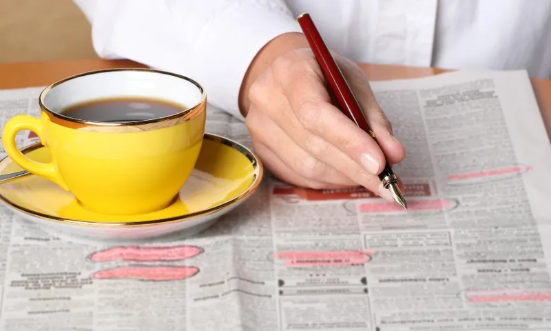 job listing with coffee cup getty