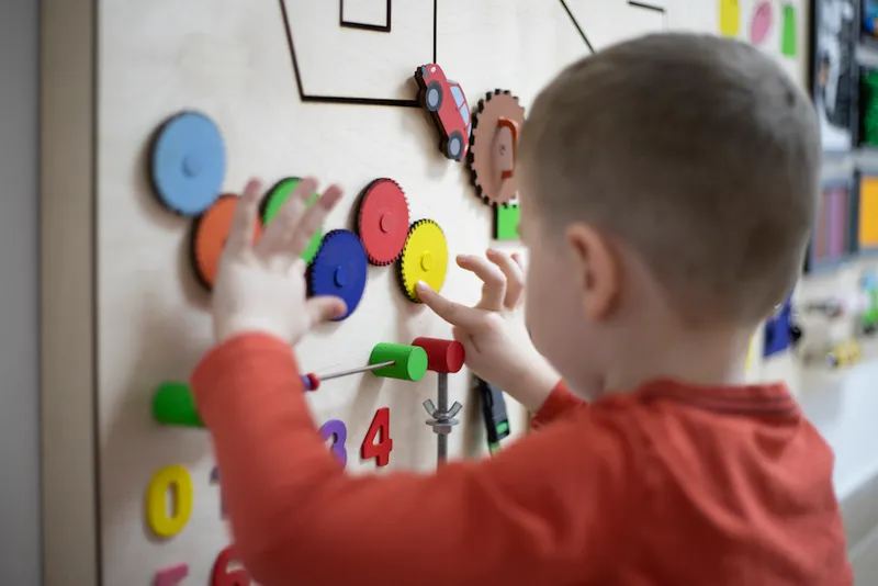 Boy playing with the interactive board
