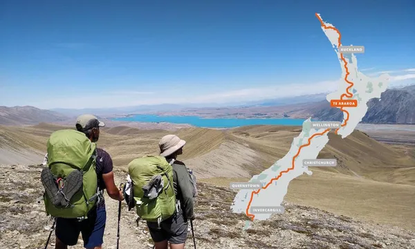 Tozan Delman and his wife on the Te Araroa trail, looking out over a mountain range. A map of the trail appears in the top right corner of the image.