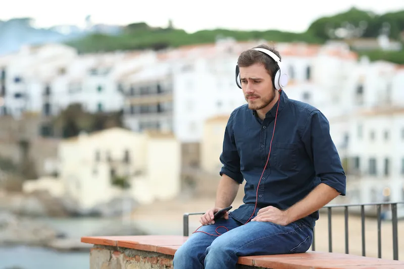 Sad man listening to music