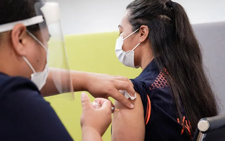 Auckland Jet Park Hotel quarantine facility worker Lorna Masoe receiving the Covid-19 vaccine on 20 February 2021.