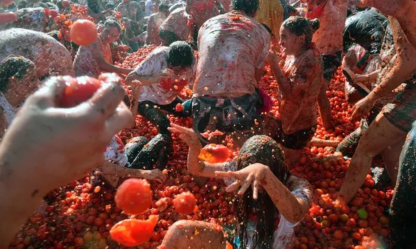 tomato fight festival, known as “tomatina”, in Sutamarchan, Boyaca department, Colombia, on June 5, 2016. / AFP / Guillermo Legaria        (Photo credit should read GUILLERMO LEGARIA/AFP via Getty Images)TOPSHOT-COLOMBIA-FESTIVAL-TOMATINA