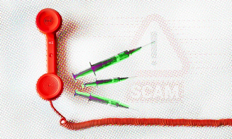 three green and purple syringes stick out from a red telephone speaker