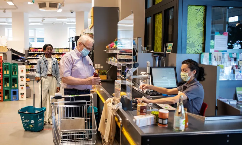Senior man buying groceries in supermarket