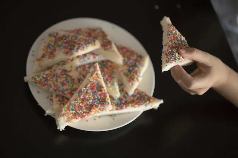 Child taking fairy bread