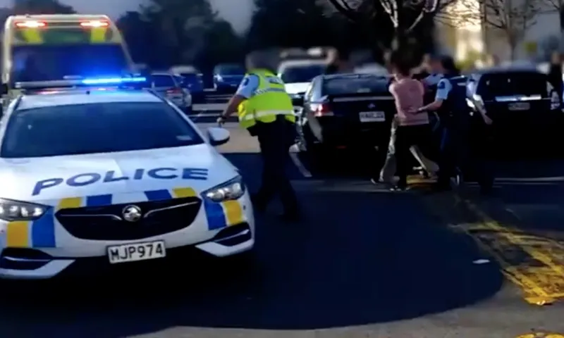 alleged attacker being led from scene dunedin radio nz