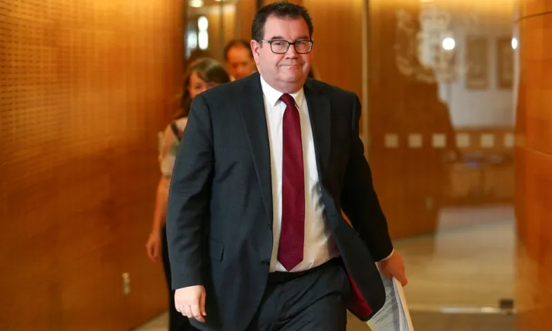 finance minister grant robertson walking into a presser getty