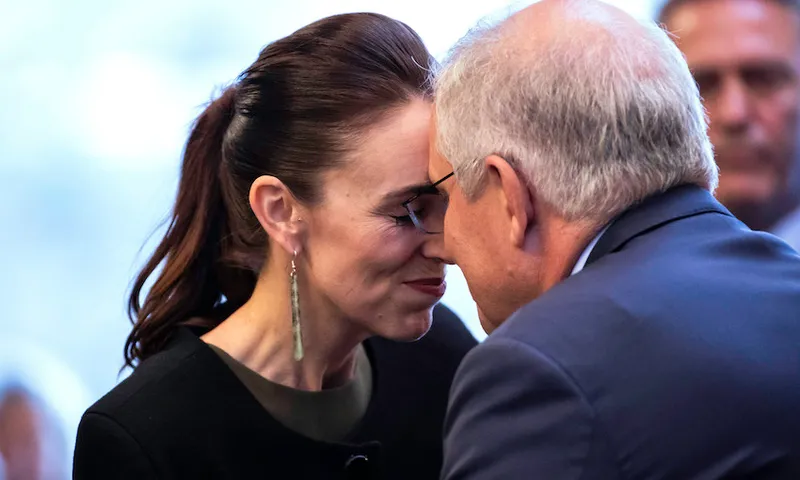Jacinda Ardern and Scott Morrison hongi. We can see that Ardern is smiling.