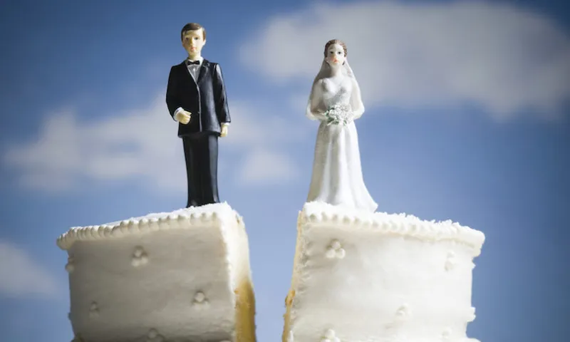 Wedding cake visual metaphor with figurine cake toppers