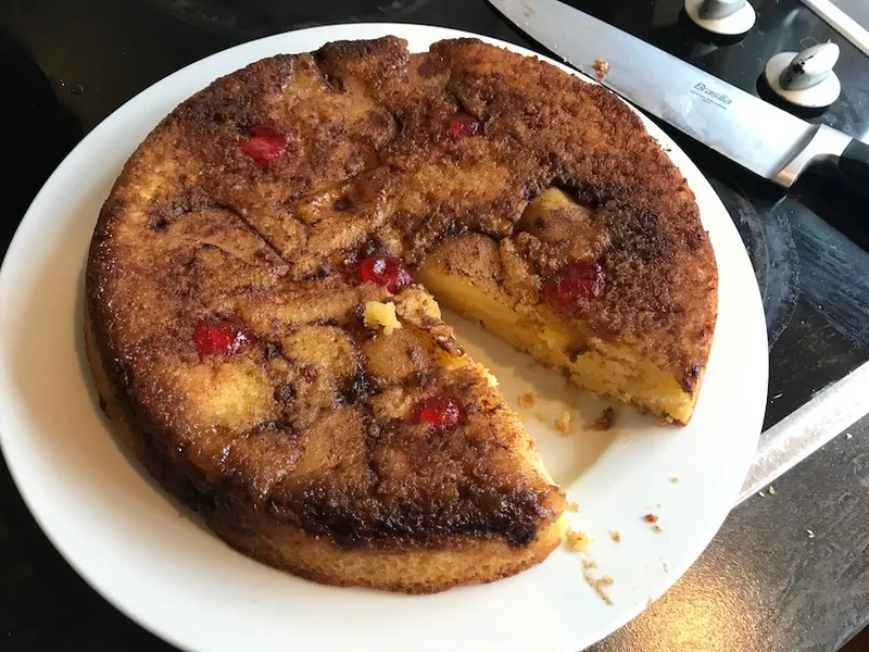 A cake on a plate, with a wedge cut out