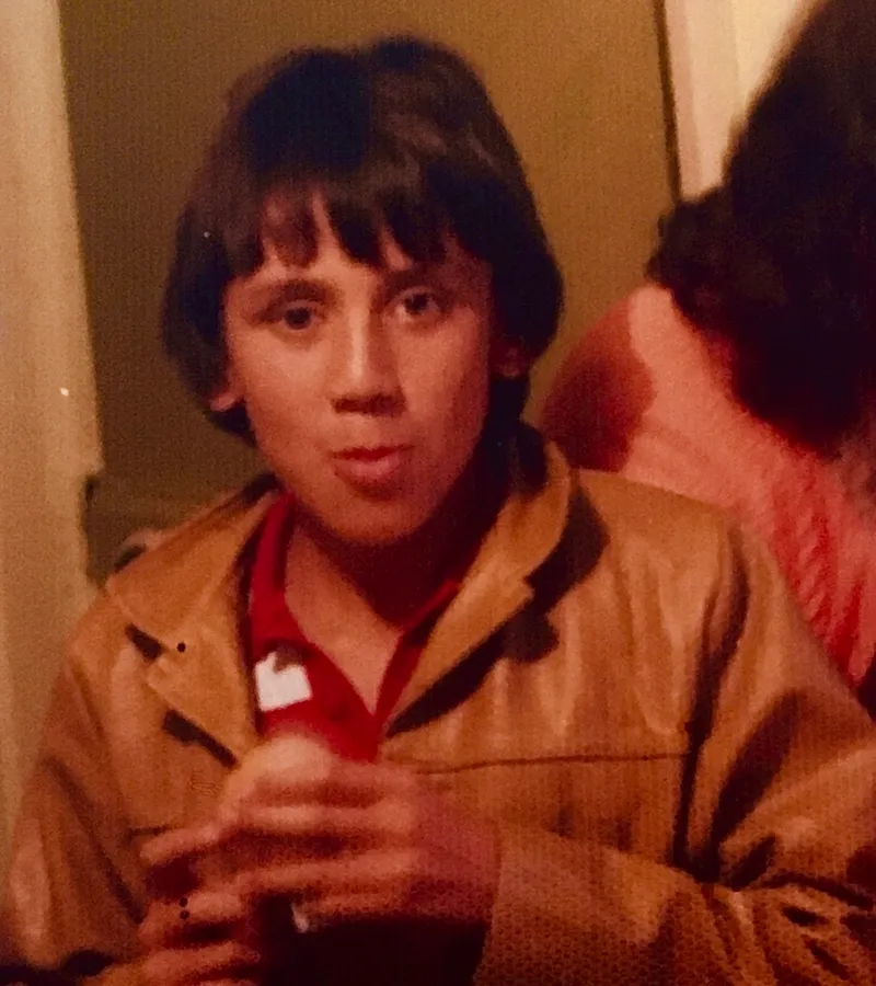 Old family photo of a boy aged approx 12? in an awesome tan leather jacket.