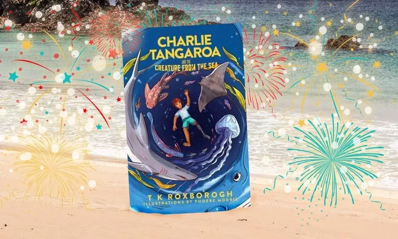 A chapter book with cover art of sea creatures is overlaid on a backdrop of fireworks, and a beach