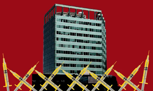 A office block surrounded by vaccine needles