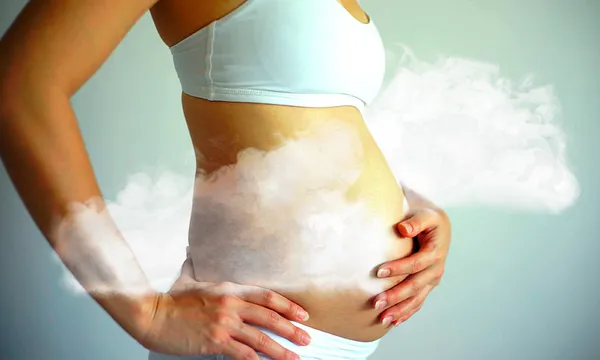 pregnant woman with smoke clouds
