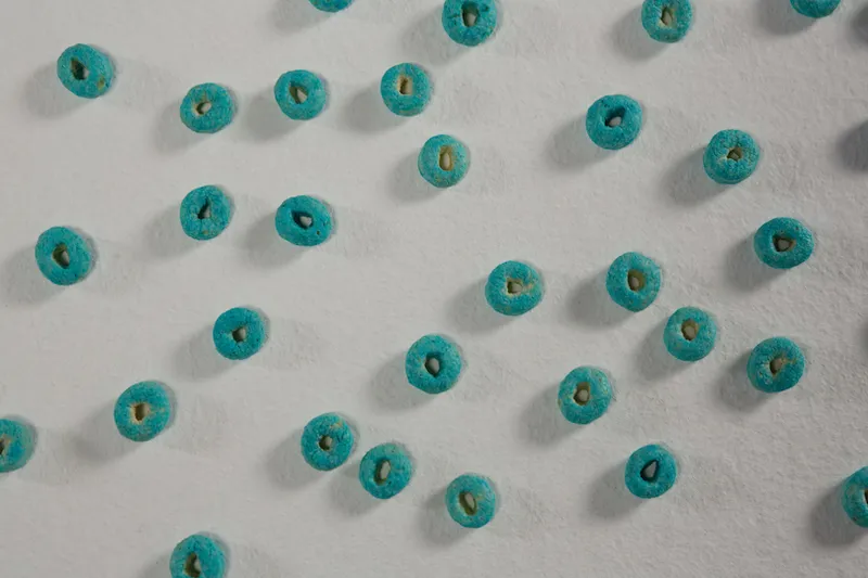 Froot loops arranged on white background