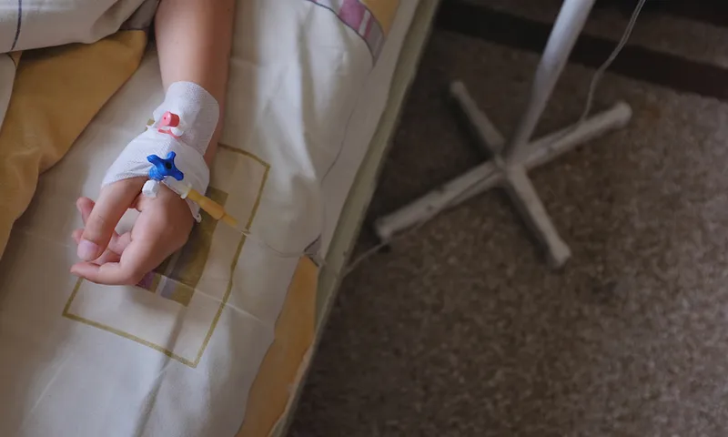Child’s hand with IV drip attached