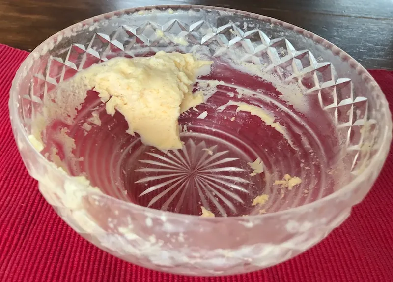 A cut-glass pudding bowl with a skerrick of creamy pudding left.