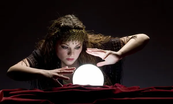 fortune teller looking at crystal ball