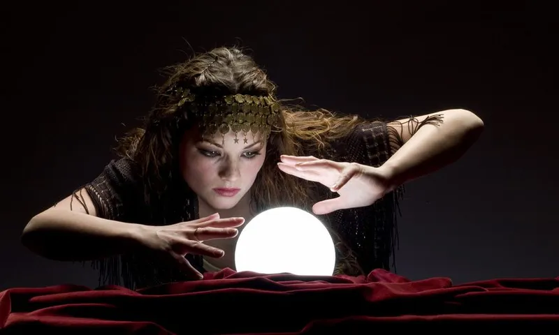 fortune teller looking at crystal ball