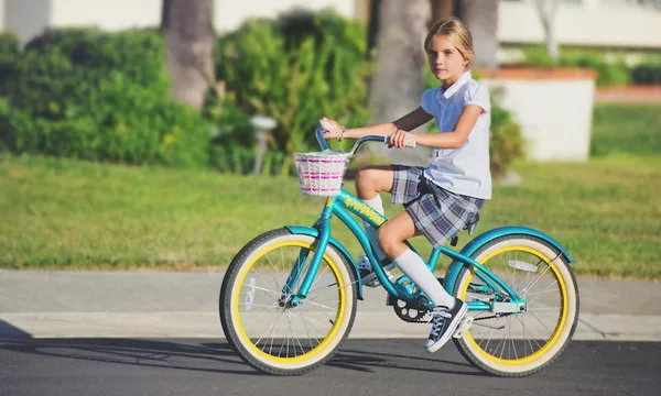 School girl riding her bike