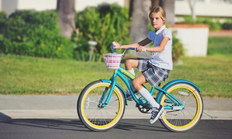 School girl riding her bike