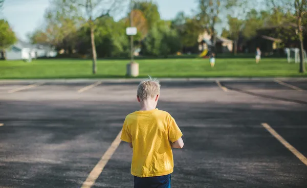 Boy walking away from camera