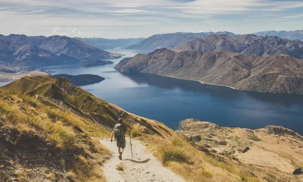 backpacker looking over a lake