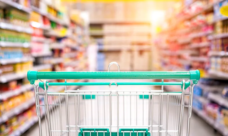 Empty shopping cart in the supermarket shopping mall