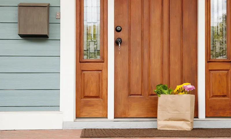 Grocery bag on front stoop