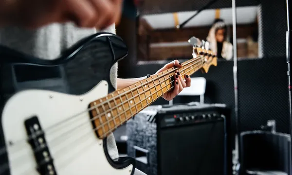 Hand of a musician on a guitar