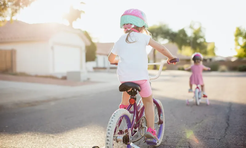 Young Girls Riding Bikes