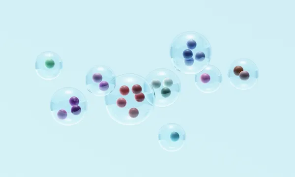 Spheres within glass spheres