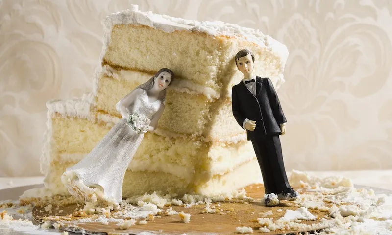 Wedding cake visual metaphor with figurine cake toppers