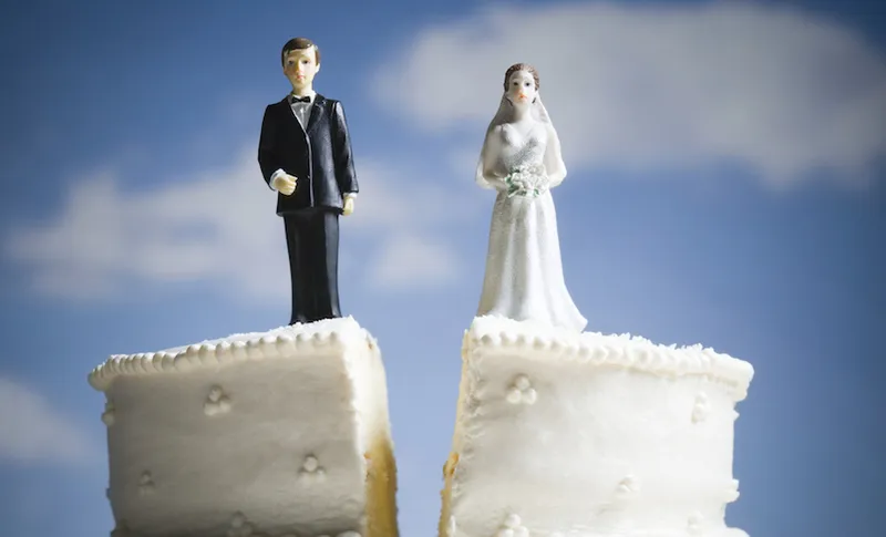 Wedding cake visual metaphor with figurine cake toppers