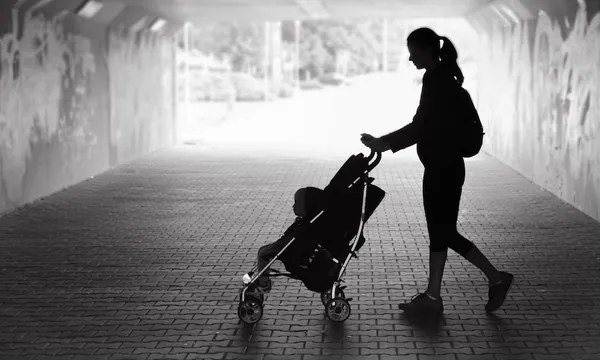Woman walking with her son in the city