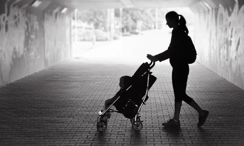 Woman walking with her son in the city