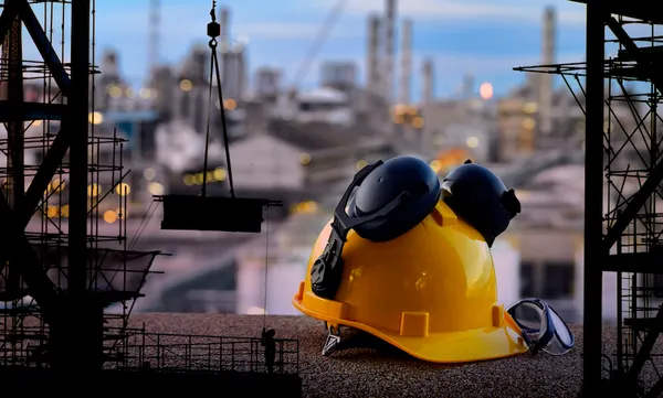 Set of safety work wear on  construction background ,Work safety at construction site concept .