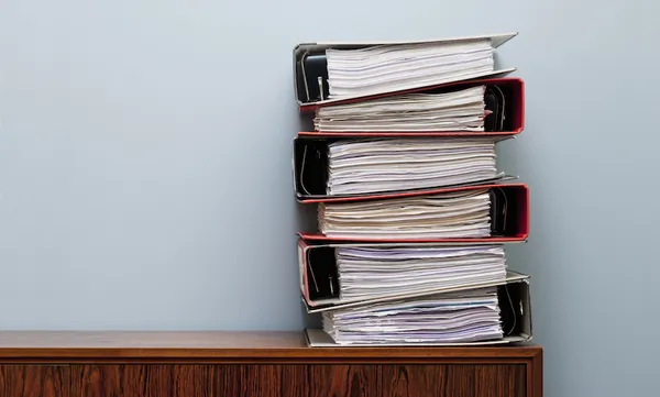 Ring binders on cabinet