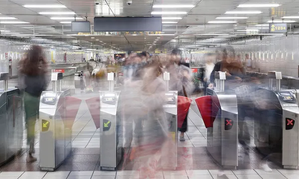 Commuters walking through Subway station